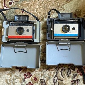 Two Polaroid Land Cameras